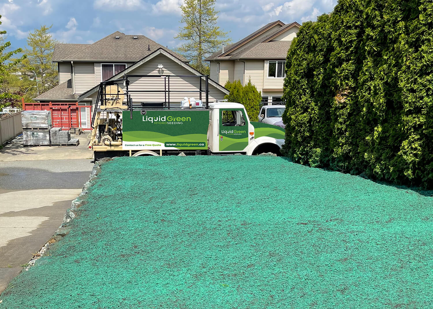 liquid green hydroseeding spray on grass front yard residential